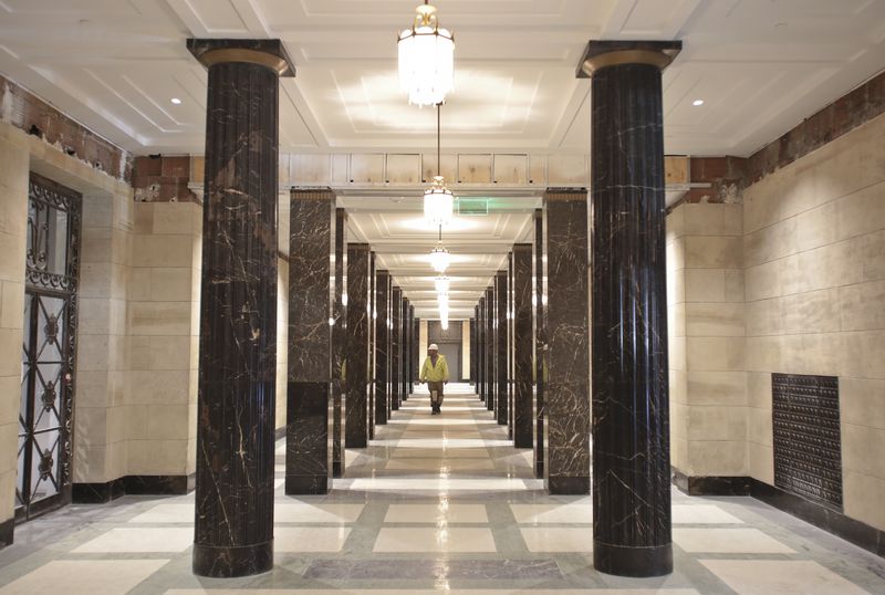 The historic colonnade on the first floor has been restored, including the removal of paint from sandstone walls.