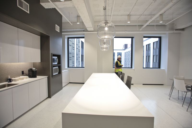 Architect for the renovation of the State Office Building Anthony Amenta of Amenta Emma Architects in Hartford examines one of the completed employee break rooms.